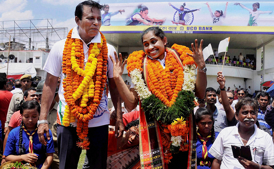 Gymnast Dipa Karmakar waves during her felicitation parade after her return from Rio Olympics, upon her arrival at the airport on the outskirts of Agartala, India, August 22, 2016.
![Firstpost